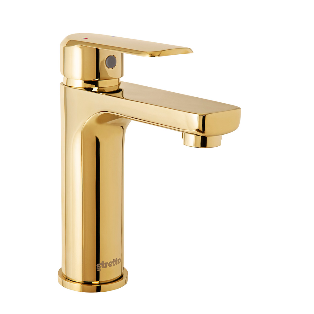 chrome and gold coloured wash basin taps(griferia)