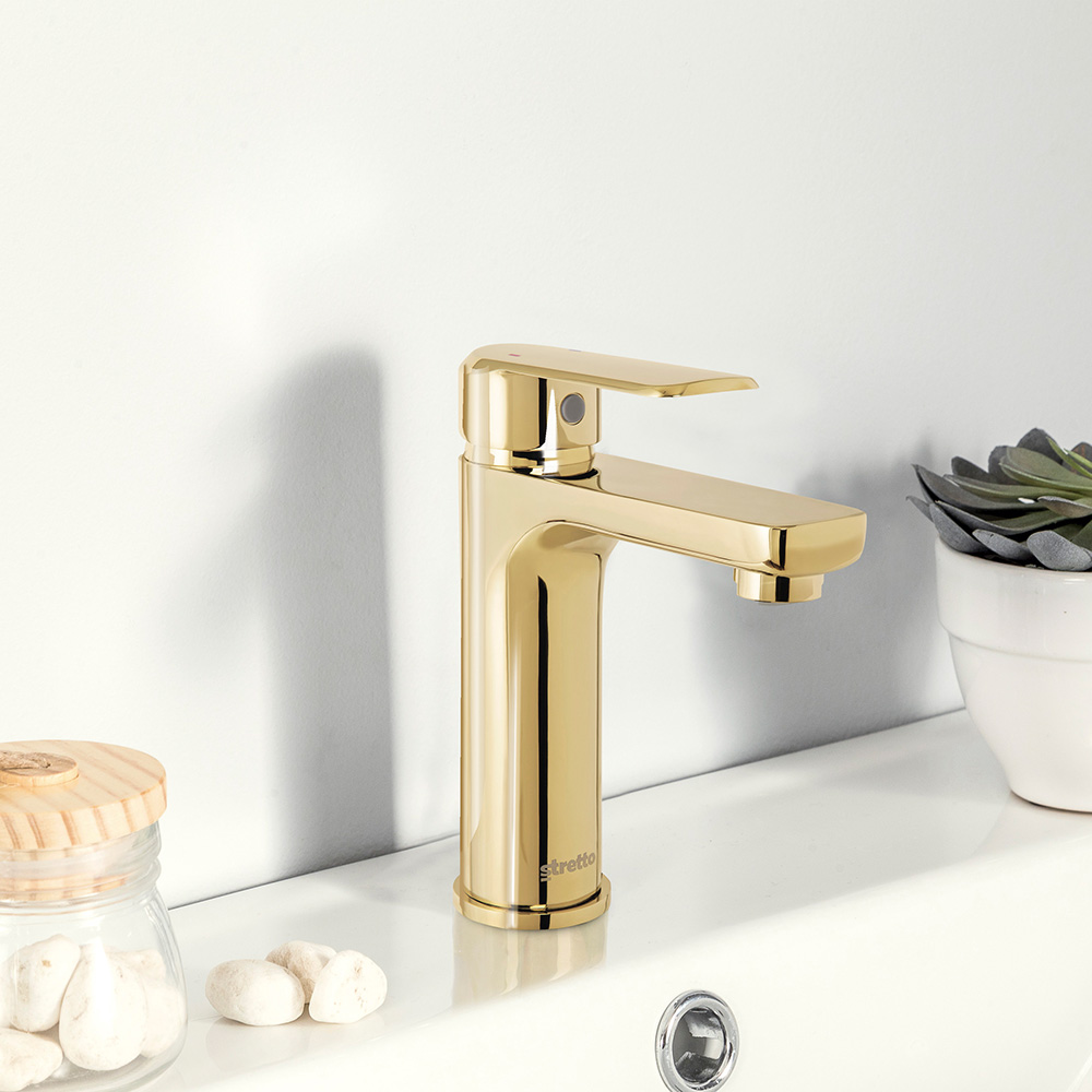 chrome and gold coloured wash basin taps(griferia)